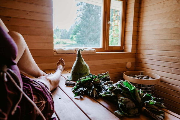Person sitting in a sauna