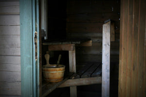 Historic sauna with wooden structure, showcasing traditional design and rustic elements.