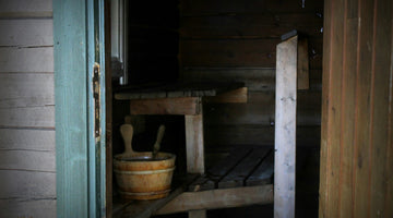 Historic sauna with wooden structure, showcasing traditional design and rustic elements.