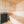 Wooden sauna with a black sauna heater and white bench by Finnish Sauna Builders