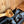 Homecraft H-Series Electric Sauna Heater Wooden spoon over hot stones in a sauna setting