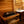 Homecraft H-Series Electric Sauna Heater Wooden sauna with rocks in a basket and a sink in the background