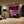 Modern bedroom with a large wardrobe and cityscape view