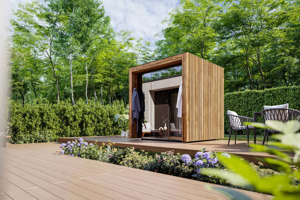 Modern garden shed with wooden exterior on a deck surrounded by greenery