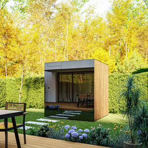 Modern garden shed in a lush green garden with trees in the background